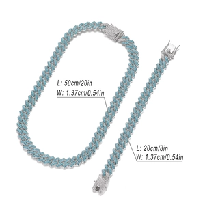 Detailed view of blue iced-out Cuban link chain set with necklace and bracelet dimensions