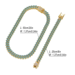 Detailed view of 14mm punk style iced out blue crystal cuban link chain and bracelet set