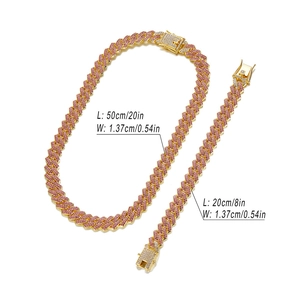 Pink iced out Cuban link chain necklace and bracelet set in gold finish for hip hop fashion