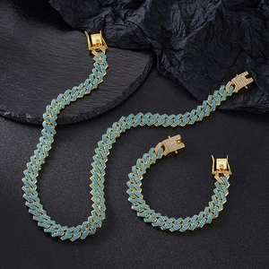 Iced out gold Cuban link necklace and bracelet set with vibrant blue pavé rhinestones