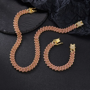 Detail of 14mm Cuban link necklace and bracelet set with pink and clear crystals