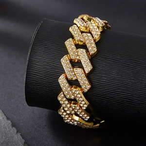 Close-up of 20mm gold Cuban link chain with double row diamonds in hip hop style
