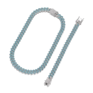 Icy blue iced-out Cuban link chain and bracelet set with sparkling blue stones