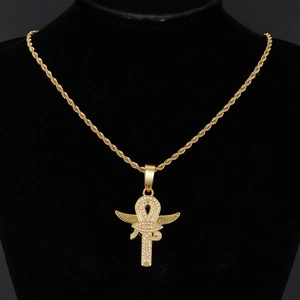 Gold Eye of Horus Ankh cross pendant necklace with sparkling rhinestones on black bust