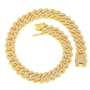 Golden 20mm iced out Cuban link necklace with double row crystals on white background
