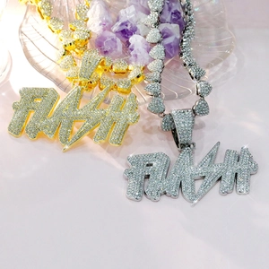 Detailed macro of FLASH letter pendant encrusted with diamonds on a gold and silver chain