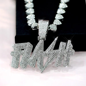 Close-up of iced-out FLASH pendant with lightning design and heart shaped Cuban chain