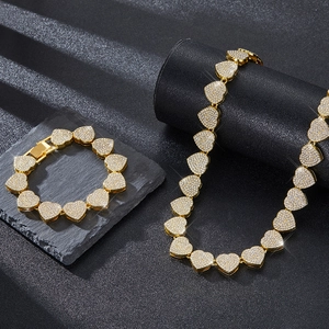 Parure hip hop collier et bracelet à maillons cœur dorés sertis de strass brillants de luxe