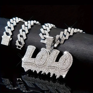 Hip hop jewelry set featuring iced out Cuban link chain and LOLO pendant with drip effect