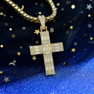 Detailed macro view of hip hop cross pendant with paved zircon on blue starry background