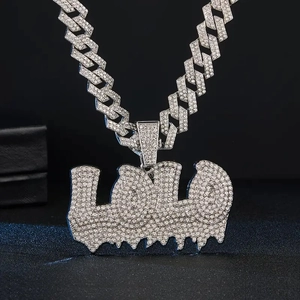 Close-up of hip hop Cuban chain with LULU letters pendant and sparkling zircons