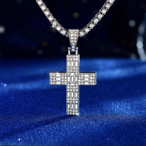 Close-up of hip hop silver cross pendant with square diamonds on a tennis chain