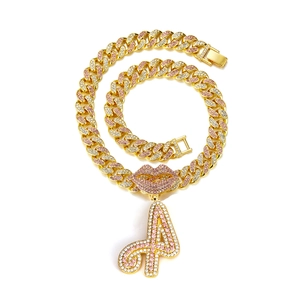 Iced out Cuban chain necklace with pink rhinestone lips and letter A pendant