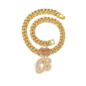 Gold hip-hop Cuban link chain with a pink rhinestone lip and letter B pendant