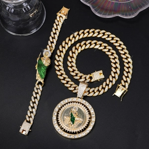 Close-up of hip-hop gold Cuban chain set with iced out rhinestones and St. Jude pendant