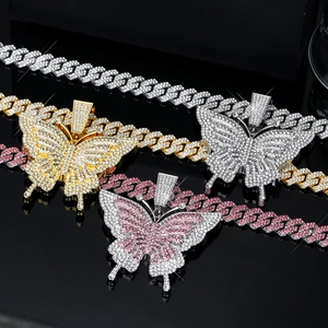 Detailed view of hip hop butterfly necklaces in gold, silver and pink crystal finishes