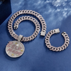 Macro shot of iced out Cuban link chain set with pink and white rhinestones in street style