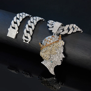 Close-up of hip-hop cuban chain with iced-out queen pendant and multi-color crystals