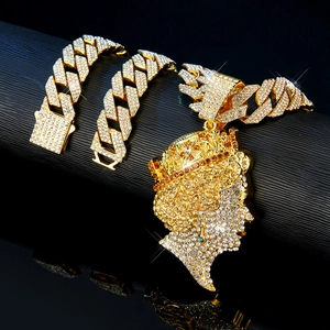 Close-up of hip hop Queen portrait pendant with pavé diamonds on a Cuban chain