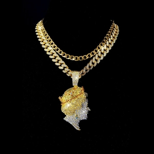 Iced out hip hop Cuban chain with gold plated queen head pendant encrusted with rhinestones