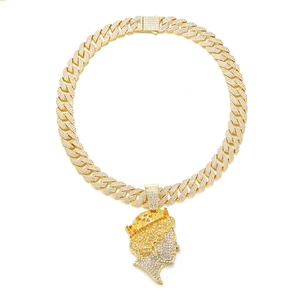 Iced out gold Cuban link necklace with large Queen head pendant and pavé crystals