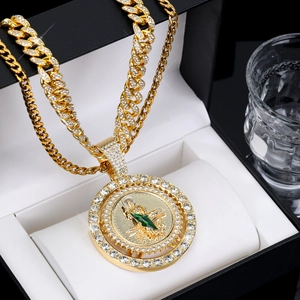 Detailed close-up of 3D St. Jude medallion on gold Cuban link chain with crystals