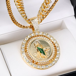 Gold Cuban chain with 3D Saint Jude spinning pendant and sparkling green rhinestones