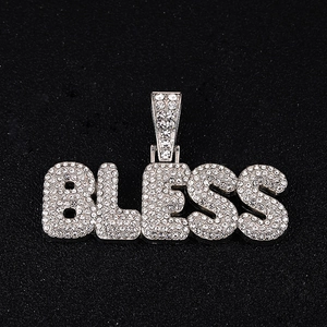 Iced out silver BLESS letter pendant on Cuban chain with pavé crystals in hip hop style