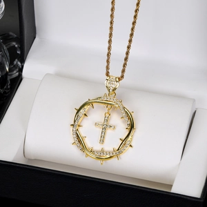 Vintage gold thorn crown cross pendant necklace with sparkling zircons on white leather