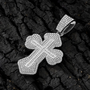 Silver iced-out double layer cross pendant with CZ stones on black background