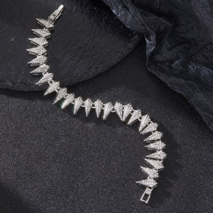 Macro detail of luxury silver hip hop bracelet with sparkling rhinestones and sharp links