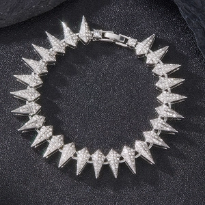 Macro shot of silver hip hop spike necklace with sparkling AAA zircons on stone background