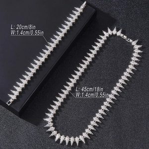 Silver-toned hip hop spikes jewelry set with sparkling rhinestones and size details