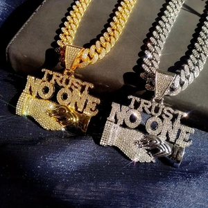 Iced out Cuban link necklace with Trust No One pendant in gold and silver finish