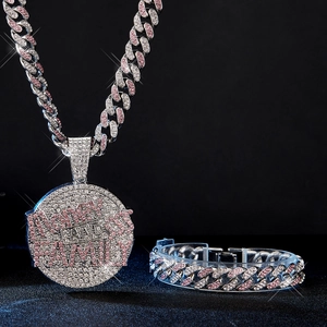 Detail of hip hop Cuban link chain with money and family pink rhinestone pendant