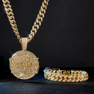 Macro shot of iced-out gold Cuban chain necklace and bracelet with crystal pendant