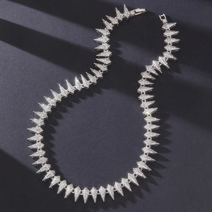 Close-up of hip hop panther necklace featuring silver spikes and sparkling rhinestones