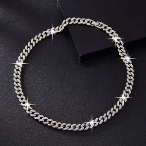 Detailed macro view of 10mm double-row silver Cuban link chain with encrusted rhinestones