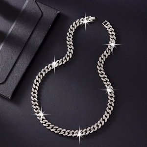 Silver 10mm double row iced-out Cuban link necklace in hip hop style on black background