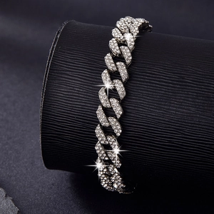 Detailed view of silver Cuban link bracelet with double row diamonds on black stand