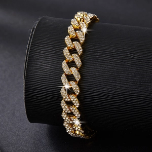 Close-up of gold double-row rhinestone Cuban chain with high shine and luxury finish