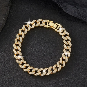 Detail of gold-plated double-row crystal Cuban link chain with a heavy jewelry clasp