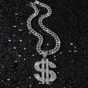 Iced out dollar sign pendant on heavy Cuban link chain with shimmering silver finish