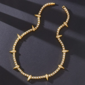 Gold plated tennis necklace with spiked diamond pendants and cuban chain design