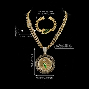 Iced out gold Cuban link chain set with spinning St. Jude pendant and green enamel