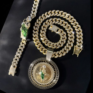 Iced out gold St. Jude Cuban chain jewelry set with green enamel pendant and bracelet