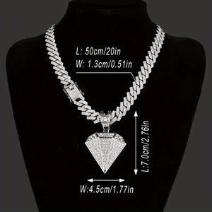 Silver Cuban link chain with large iced out diamond pendant on black jewelry bust