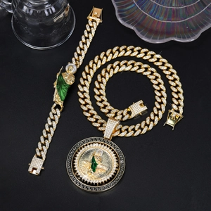 Detail of gold-plated hip hop chain with iced out Saint Jude rotating pendant