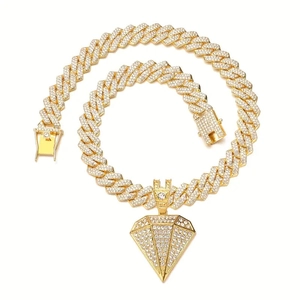 Iced out gold Cuban link chain necklace with large sparkling diamond-cut triangle pendant