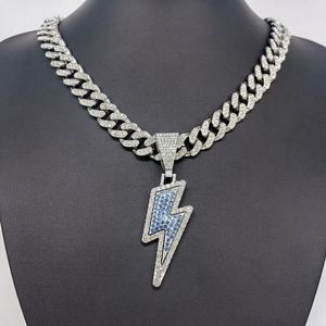 Hip hop silver Cuban link chain with iced out lightning bolt pendant and blue stone detail